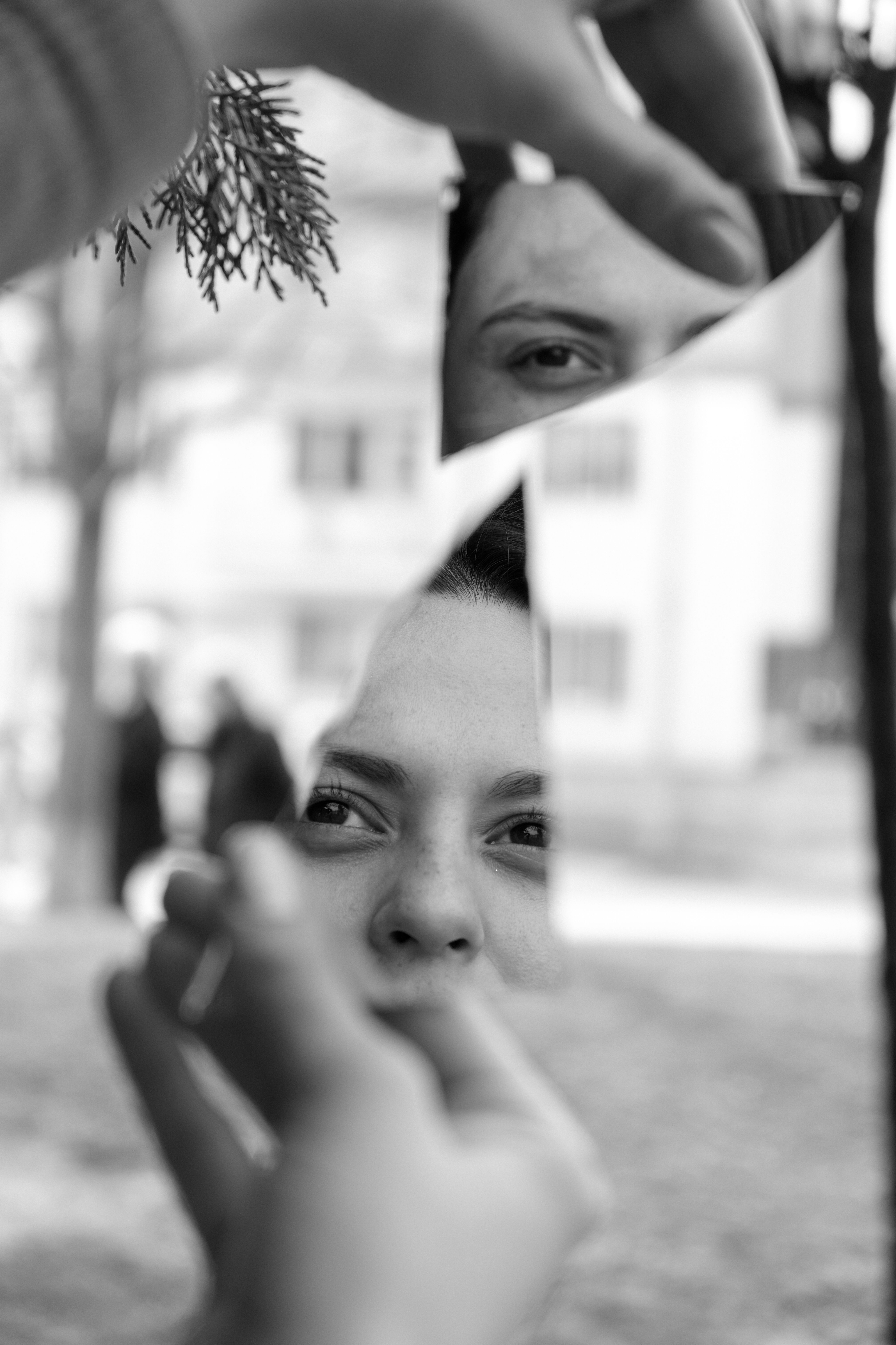 Broken mirror reflecting a woman’s face, representing self-reflection and building self-trust in recovery.
